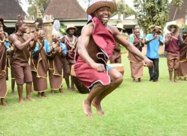 Traditional Bakiga people in Uganda showcasing culture through dance, dress, and customs.