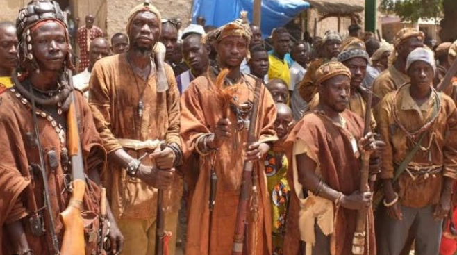 Bamba people celebrating cultural festival with traditional clothing and vibrant dance.
